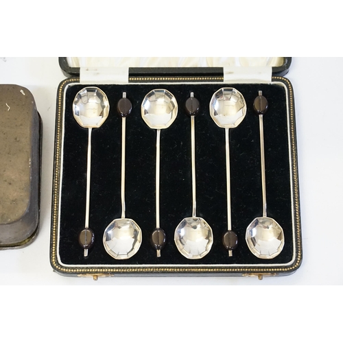 21 - A Set of 6 Bean Handled Coffee Spoons in Original Case along with three tins.