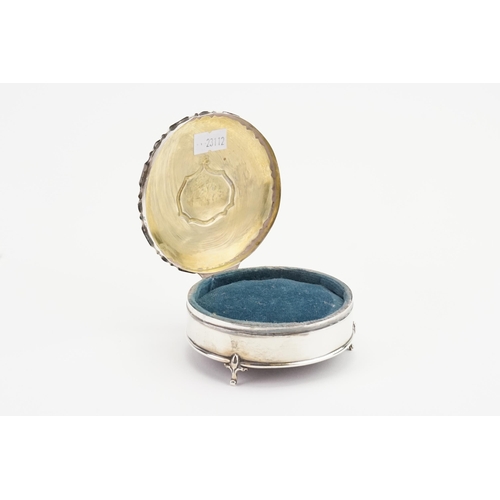 27 - A Circular Silver Jewellery Box with a Chippendale Border & Pad feet.