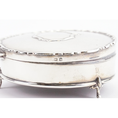 27 - A Circular Silver Jewellery Box with a Chippendale Border & Pad feet.