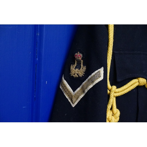 285 - A Navy Blue & White Trimmed Mess Jacket with Yellow Rope Sash, Lyre & Oakleaf Crest along with Match... 