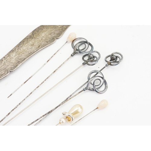 167 - A Collection of Four Art Nouveau Silver Mounted Hat Pins made by Charles Horner.