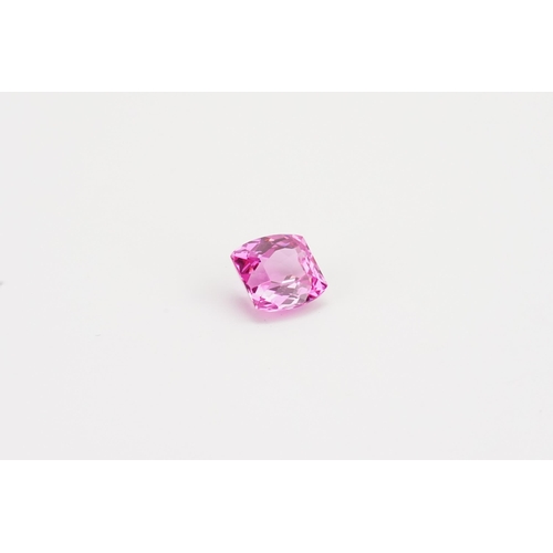 72 - A cushion cut pink  synthetic Topaz stone. Weight 2.47g. 12.39ct.