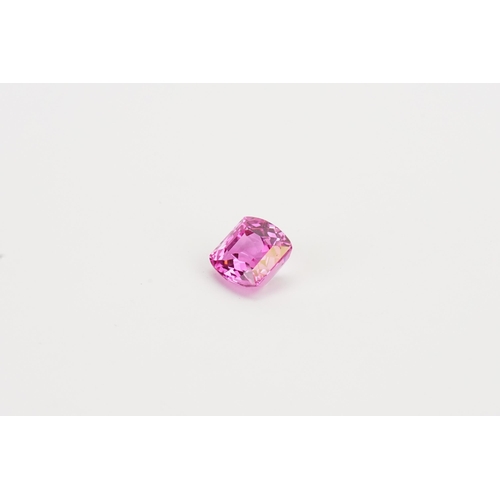 72 - A cushion cut pink  synthetic Topaz stone. Weight 2.47g. 12.39ct.