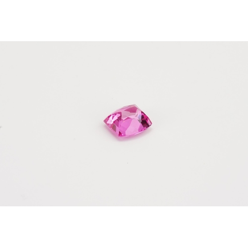 72 - A cushion cut pink  synthetic Topaz stone. Weight 2.47g. 12.39ct.