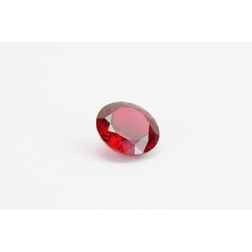 73 - A large round cut red synthetic Topaz. Weight 10.45g. 52.32ct.