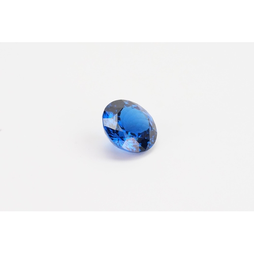 74 - A blue round cut synthetic Topaz 39.29ct. Weight 7.9g.