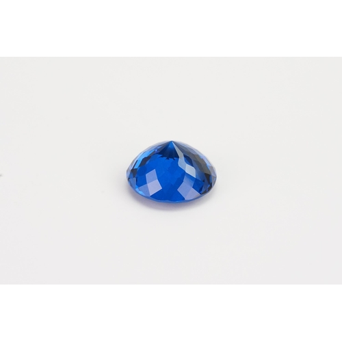 74 - A blue round cut synthetic Topaz 39.29ct. Weight 7.9g.