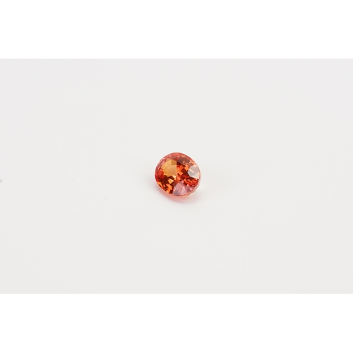 77 - An orange oval cut synthetic Sapphire 7.45ct. Weight 1.49ct.