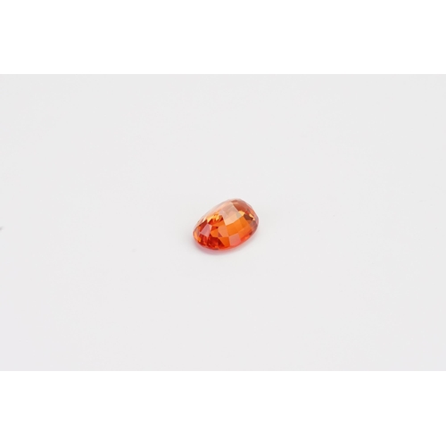 77 - An orange oval cut synthetic Sapphire 7.45ct. Weight 1.49ct.