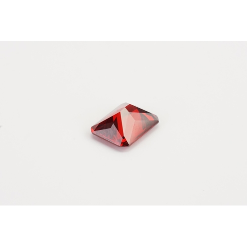 78 - A large Synthetic Emerald cut garnet. 38.4ct. Weight 7.6g.