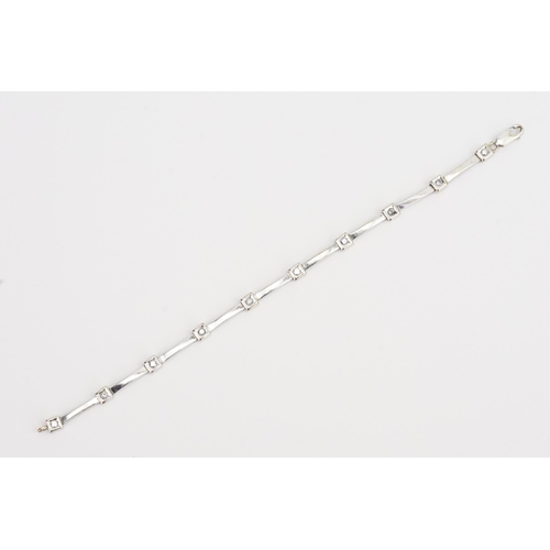 84 - A 9ct Gold diamond set bracelet, set with 10 diamonds. Diamond approx 0.06ct each. Weight 9.9g.