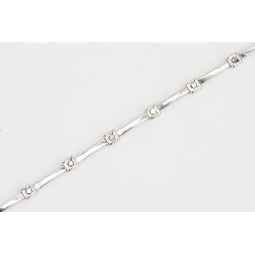 84 - A 9ct Gold diamond set bracelet, set with 10 diamonds. Diamond approx 0.06ct each. Weight 9.9g.