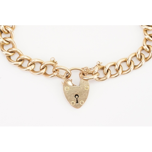 109 - A 15ct love heart locket bracelet, with safety chain. Weight 14.6g.