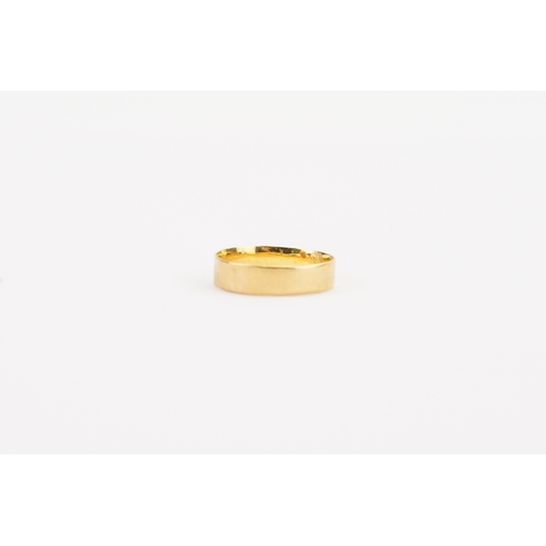 110 - A 22ct wedding band. Weight 2g. Size N.