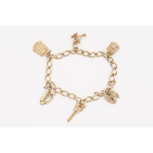 111 - A 9ct Gold charm bracelet, to include a love heart locket, key, lantern etc. Weight 12.7g.