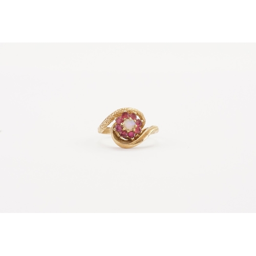 121 - A 9ct Gold ring, set with an Opal doublet & pink stones. Size M. Weight 3.3g.