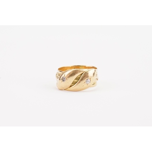 123 - A gentleman's 18ct Gold Diamond set snake ring, twin head snake decoration set with two diamonds. We... 