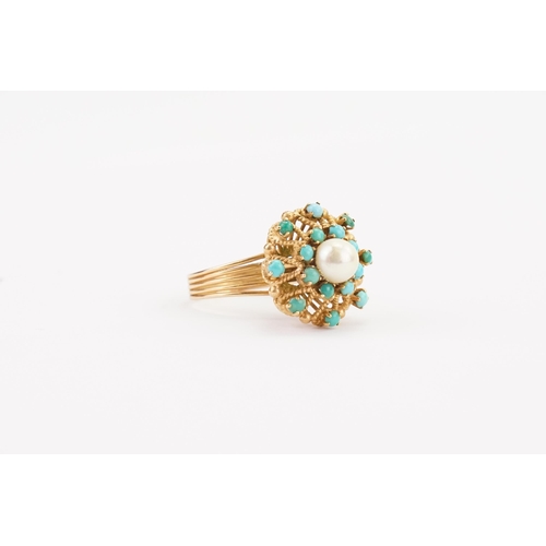 130 - A 9ct Gold Portuguese turquoise and pearl set ring, in a raised setting. Size P. Weight 6.6g.