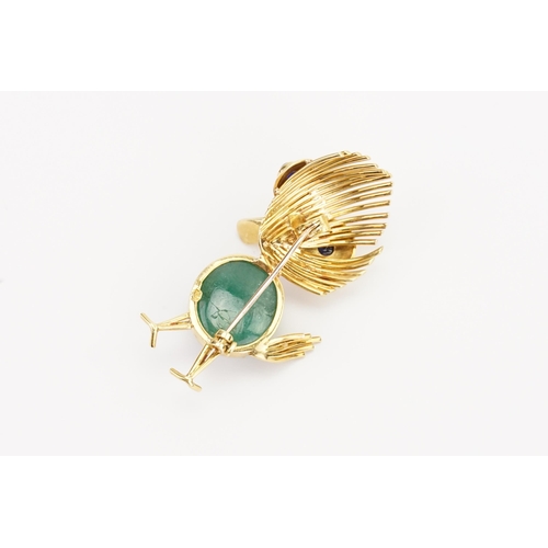 133 - A 18k Gold Sapphire and Jade set duckling brooch. Jade size approx. 14.6mm x 11.9mm. Brooch size 44m... 