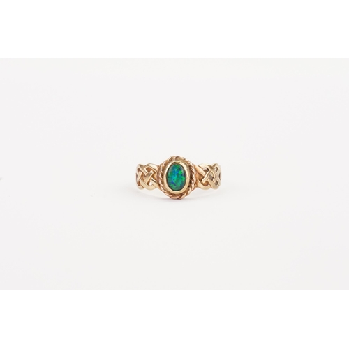 134 - A 9ct Gold Opal set ring. Size P. Weight 2.4g.