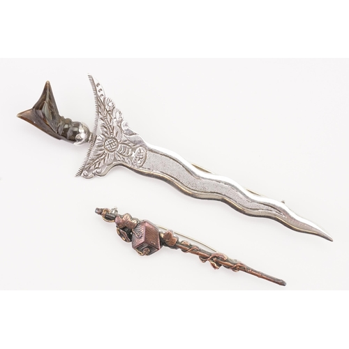 141 - An interesting carved top dagger brooch, along with a silver & brass brooch.