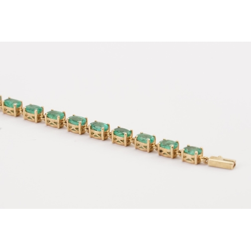 148 - A 9ct Gold Emerald set tennis bracelet. Set with 22 oval cut Emeralds. Each stone 3.9mm x 6mm. Lengt... 