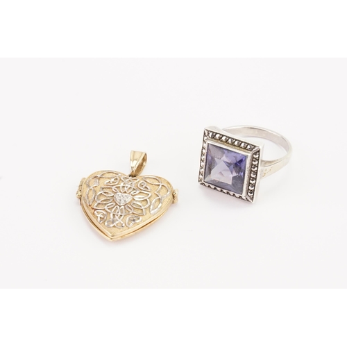 153 - A 9ct Gold Love Heart Pendant along with a Purple Stone set Silver Ring. Weight: 4 grams.