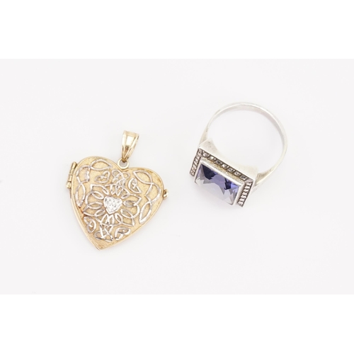 153 - A 9ct Gold Love Heart Pendant along with a Purple Stone set Silver Ring. Weight: 4 grams.