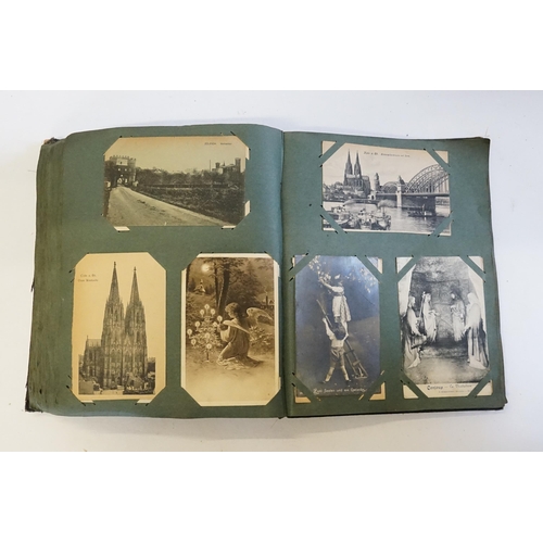 704 - An Album containing a selection of Post Cards & Silks to include a Biplane, River Scenes, Koln, Chro... 