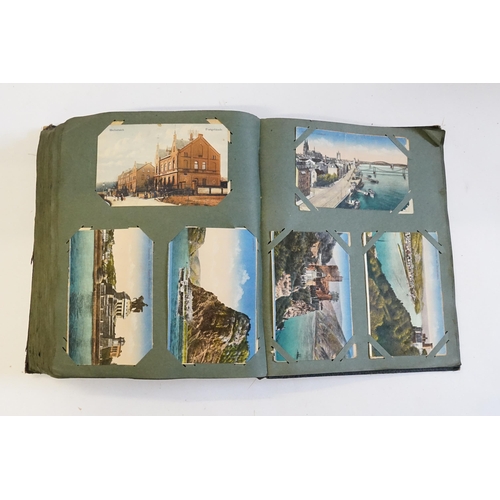 704 - An Album containing a selection of Post Cards & Silks to include a Biplane, River Scenes, Koln, Chro... 