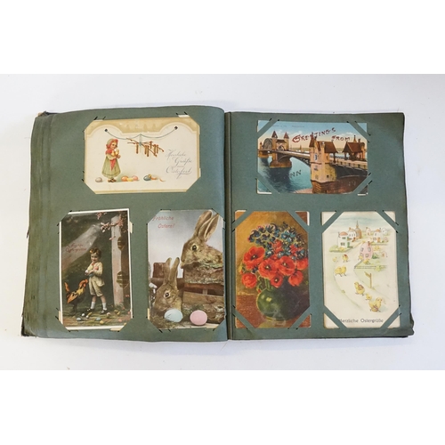 704 - An Album containing a selection of Post Cards & Silks to include a Biplane, River Scenes, Koln, Chro... 