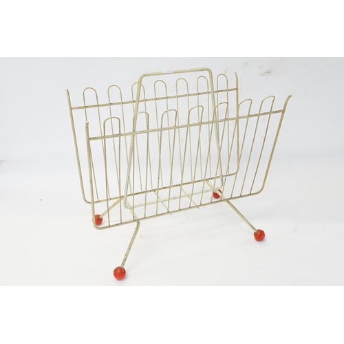 660 - A 1950s Wire Work Magazine Rack with Ball Feet.