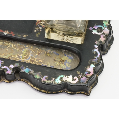 606 - A Victorian Mother of Pearl & inlaid Two Bottled Desk Stand with Verre Eglomise panels.