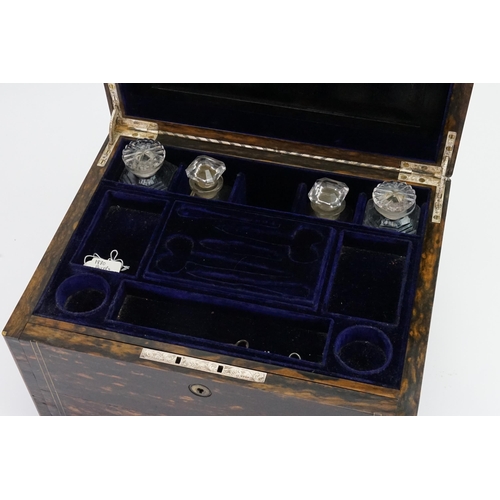 590 - A Ladies Victorian Coromandel Wood Travelling Toilet Box with a fitted interior, glass bottles & fit... 