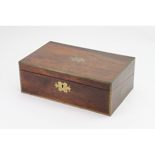 592 - A Brass bound Writing Slope with a fitted interior to include Inkwells, Pen Tray, etc including a Br... 