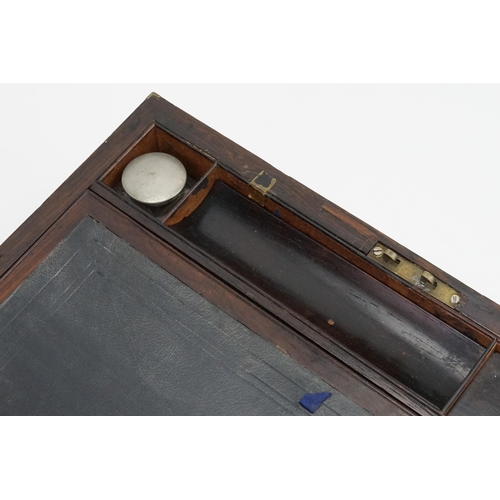 592 - A Brass bound Writing Slope with a fitted interior to include Inkwells, Pen Tray, etc including a Br... 