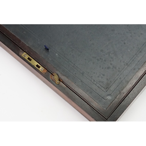 592 - A Brass bound Writing Slope with a fitted interior to include Inkwells, Pen Tray, etc including a Br... 