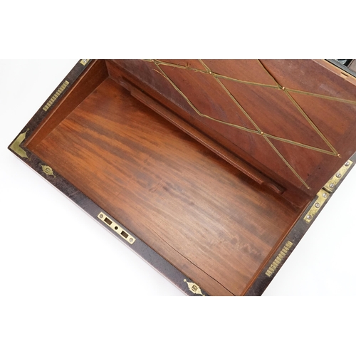 593 - An Early Victorian Campaign Writing Slope fitted with Brass edges, Brass inlay, quartered Corners, R... 