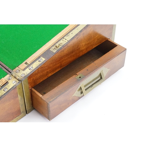 593 - An Early Victorian Campaign Writing Slope fitted with Brass edges, Brass inlay, quartered Corners, R... 