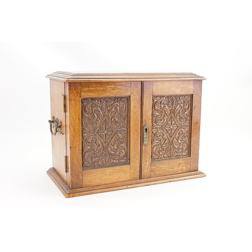 702 - A Late 19th Century Oak Lift-Top Two Drawers Pipe Rack Tobacco Cabinet with a Pottery Tobacco Box. M... 