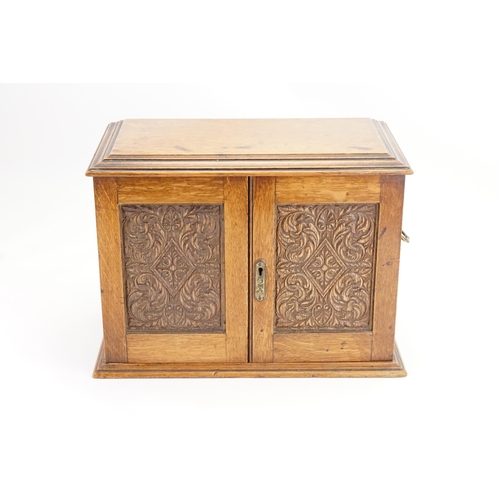 702 - A Late 19th Century Oak Lift-Top Two Drawers Pipe Rack Tobacco Cabinet with a Pottery Tobacco Box. M... 