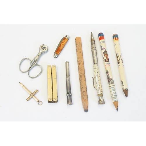 595 - A Cigar Piercer, a Cutter, a Folding Quill Cutter & a Propelling Pencil in the shape of a cross alon... 