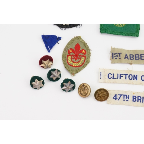 299 - A Collection of 1940s Boy Scout items to include Cloth Lapel Badges, Buttons, etc.