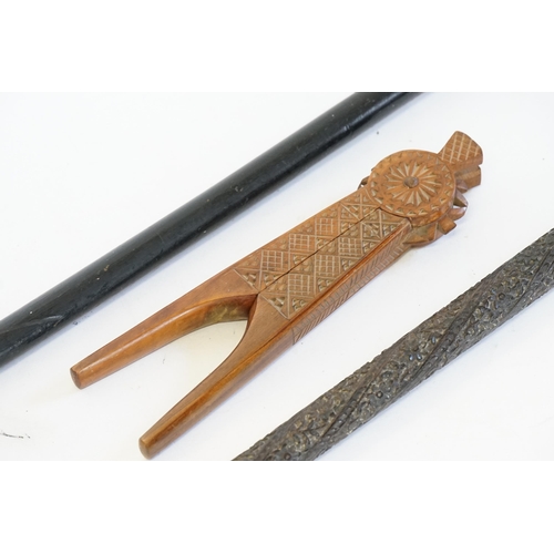 741 - A Carved Indian Walking Stick, a Pair of Chip Carved Yugoslavian Nut Crackers, a Walking Stick & a C... 