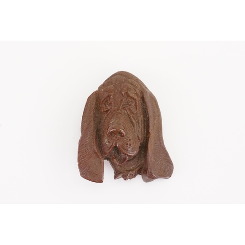 175 - A carved Bakelite dog brooch. 4cm long.