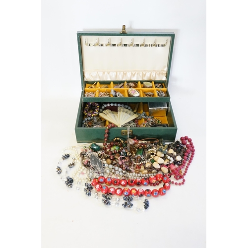 190 - A Green Jewellery Box containing various Costume Jewellery to include a Silver Brooch, Necklaces, Be... 