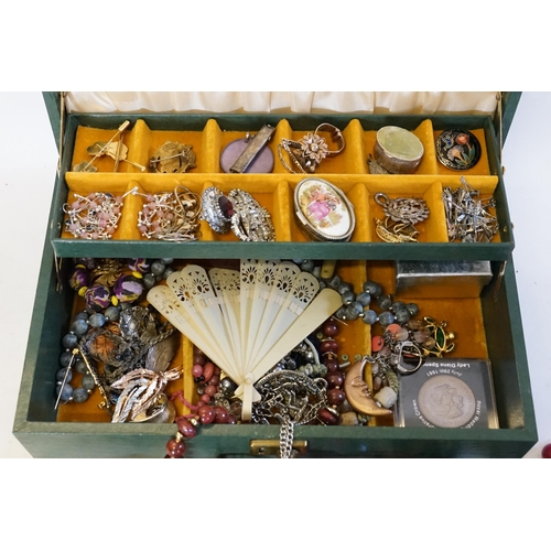 190 - A Green Jewellery Box containing various Costume Jewellery to include a Silver Brooch, Necklaces, Be... 