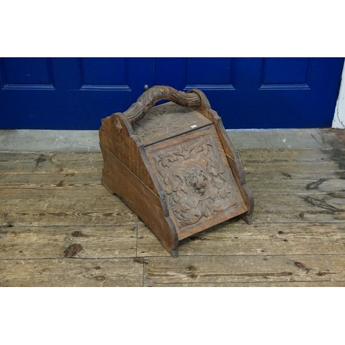 482 - An Antique Wooden Coal Scuttle with a Lion Crest.