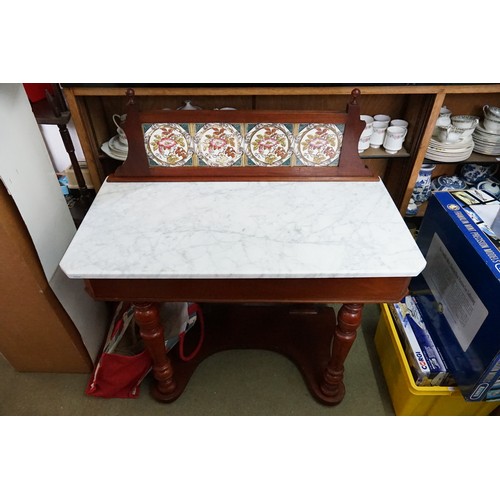 542 - A Victorian Tile Topped Wash Stand with a Fitted Marble Effect Top resting on turned front legs. Mea... 