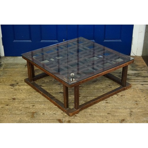 541 - A Hardwood Framed Lattice Work Top Glass Topped Coffee Table resting on Shaped Legs. Measuring: